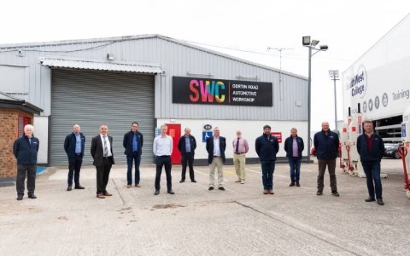 South West College Automotive department staff standing outside SWC's Gortin Road Automotive Workshop